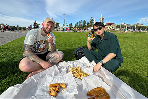 AHN-Homestay-Host-and-Guest-Enjoying-Fish-and-Chips