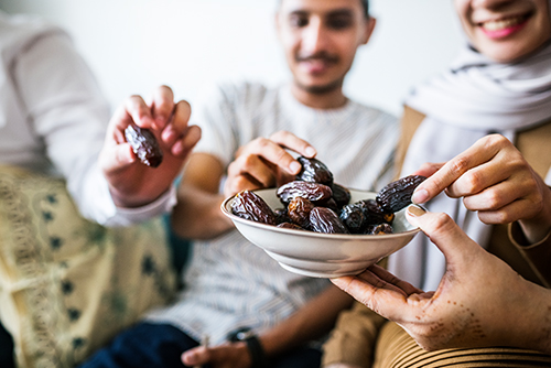 Muslim People Eating Dates